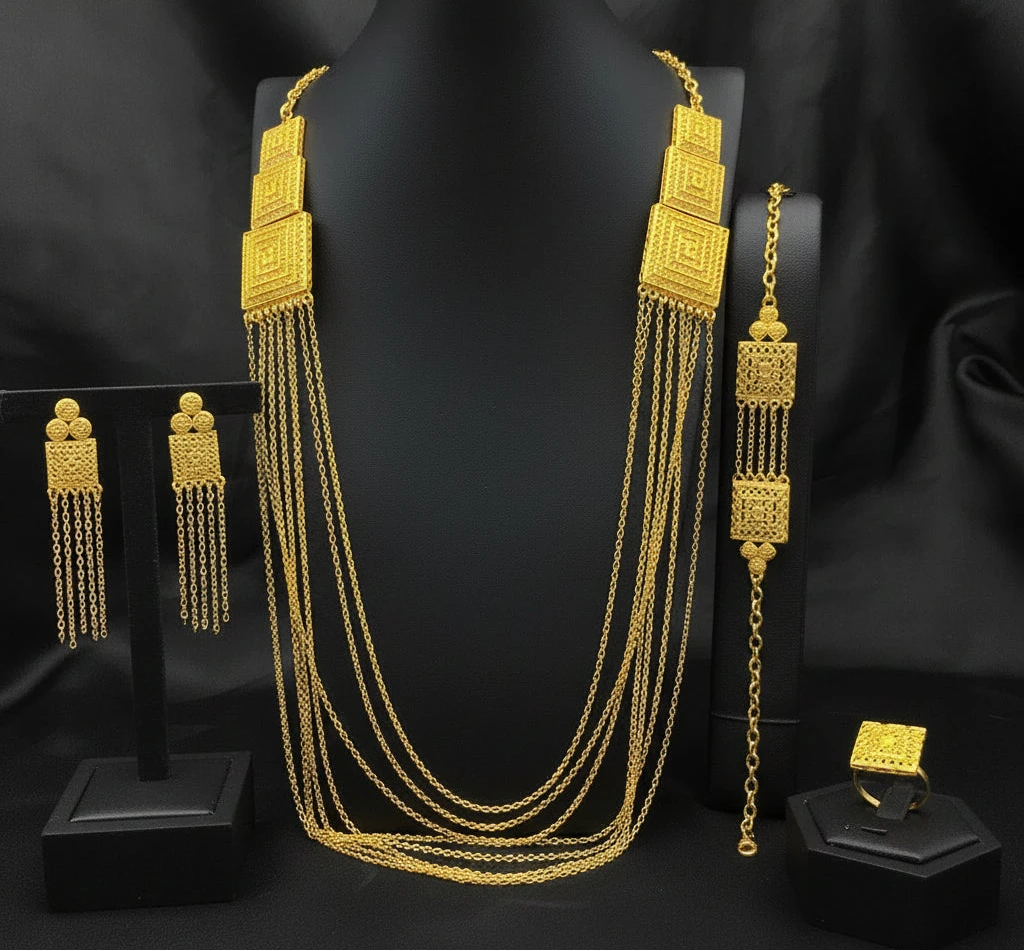 Art Deco geometric square block gold-plated necklace set with multi-strand chains, earrings, bracelet, and ring.