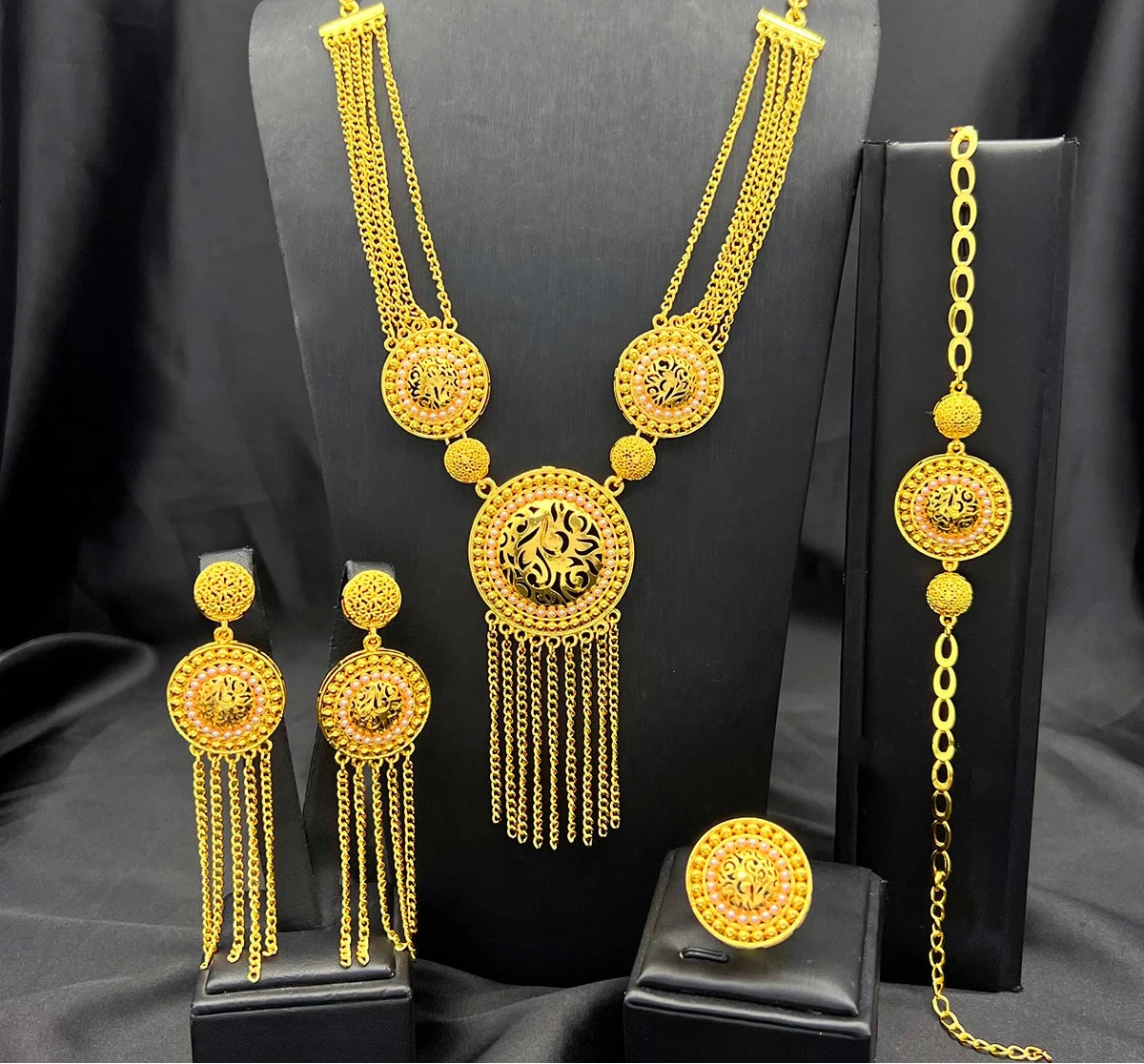 Ornate turquoise circle filigree gold-plated jewelry set with necklace, earrings, bracelet, ring and fringe tassels.