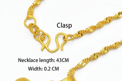 Gold necklace with clasp and measurements on a white background
