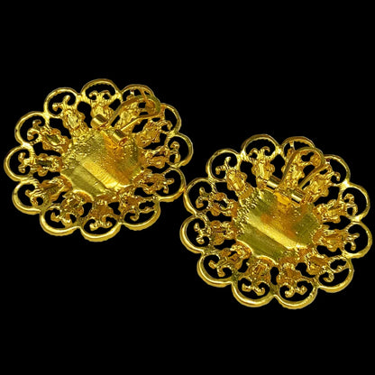 Pair of gold earrings on a black background- back of the earrings