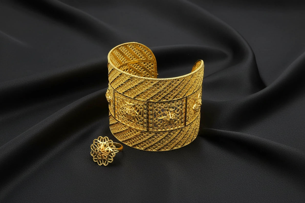 Gold bracelet and ring on a black stand -charm jewelry