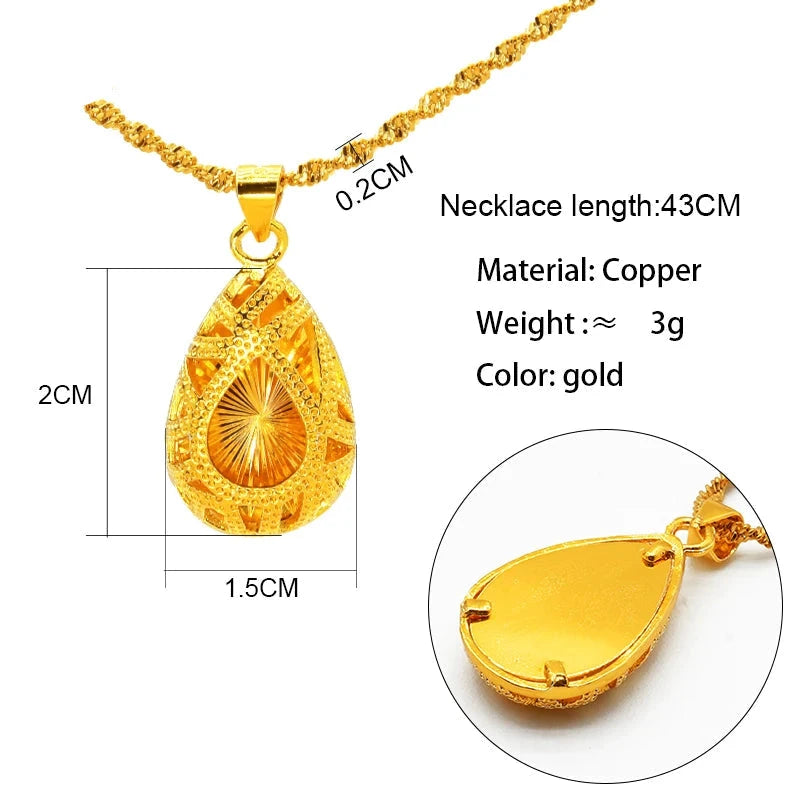 Gold necklace with teardrop pendant and measurement details on a white background