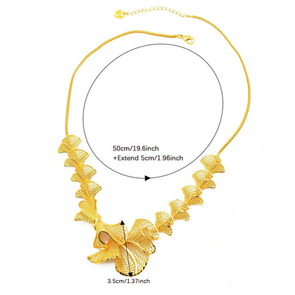 gold plated bow statement necklace with sculpted ribbon design
and measurement details on a white background