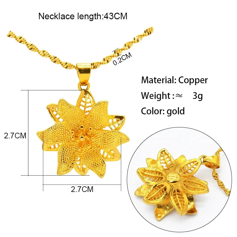 Gold necklace with a floral sharp ended pendant, showing measurements and material details.
