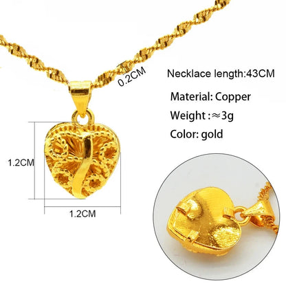 Gold necklace with heart-shaped with chains pendant on a white background, showing measurements and material details.